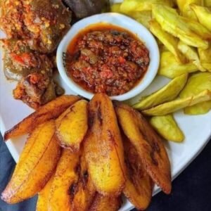 Peppered Gizard served with fried plantain and yam