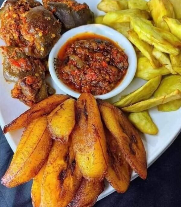 Peppered Gizard served with fried plantain and yam