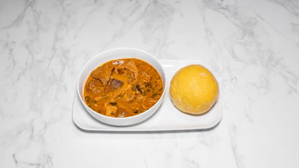 Garri with Ogbono Soup garnised with Assorted Protein